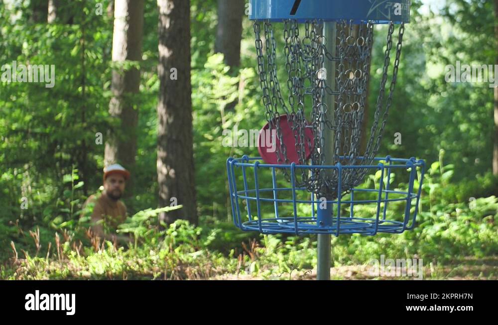 Disc Golf carts in the forest. Discus Throwing a golf disc into the