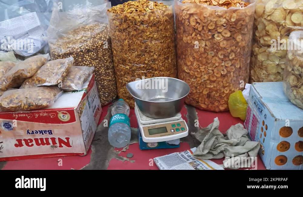 Fried Potato Chips And Banana Chips In Transparent Polythene Sacks for