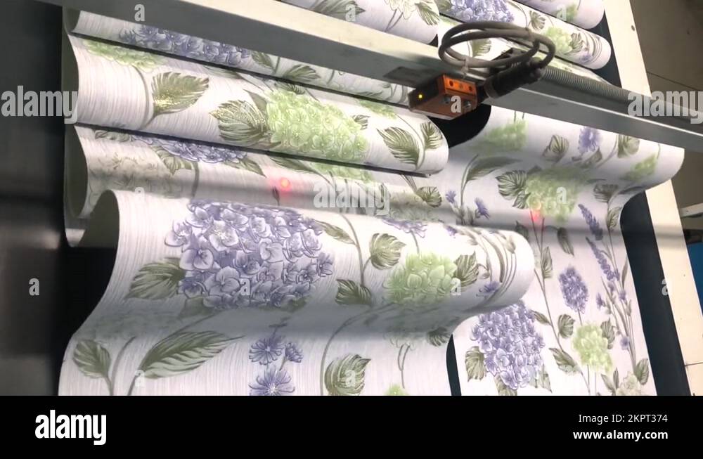 Wallpaper on a conveyor belt. Wallpaper production in a modern factory