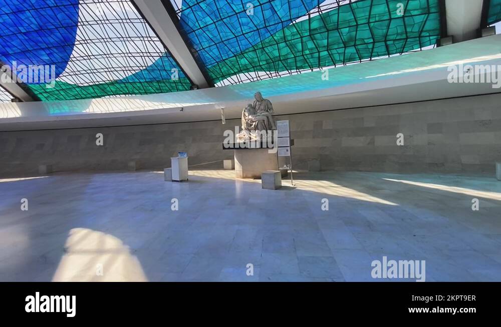 sliding shot across the hall to one of the sculptures located in the