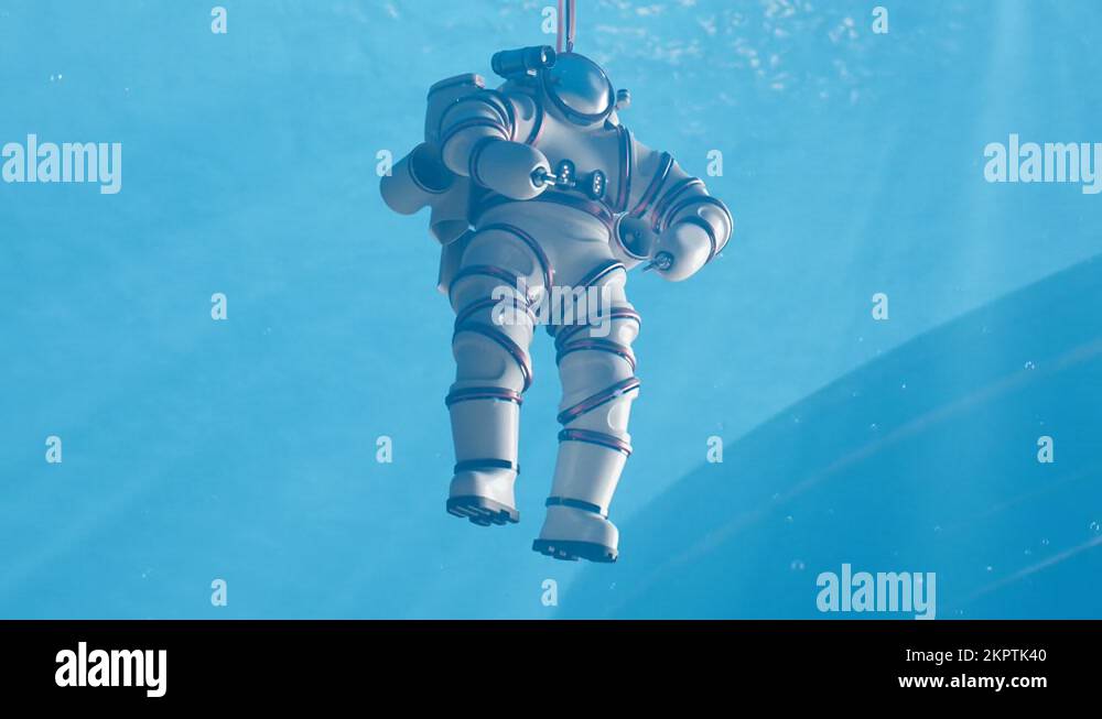 Diver in a high tech exosuit in a deep sea. Underwater discovering