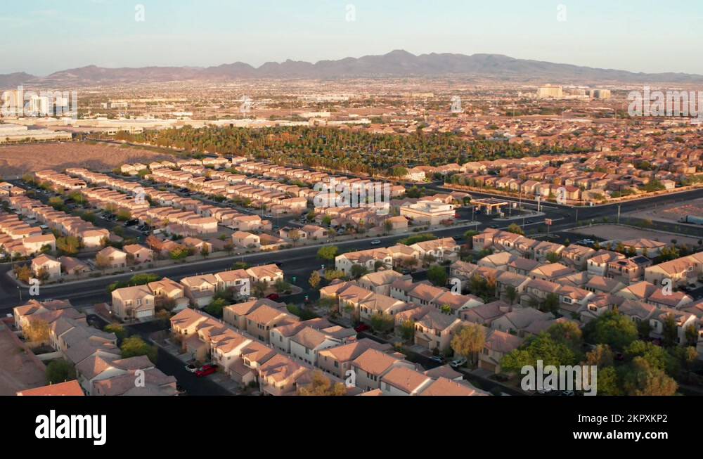 Aerial rotating shot of Las Vegas suburbs during golden hour with