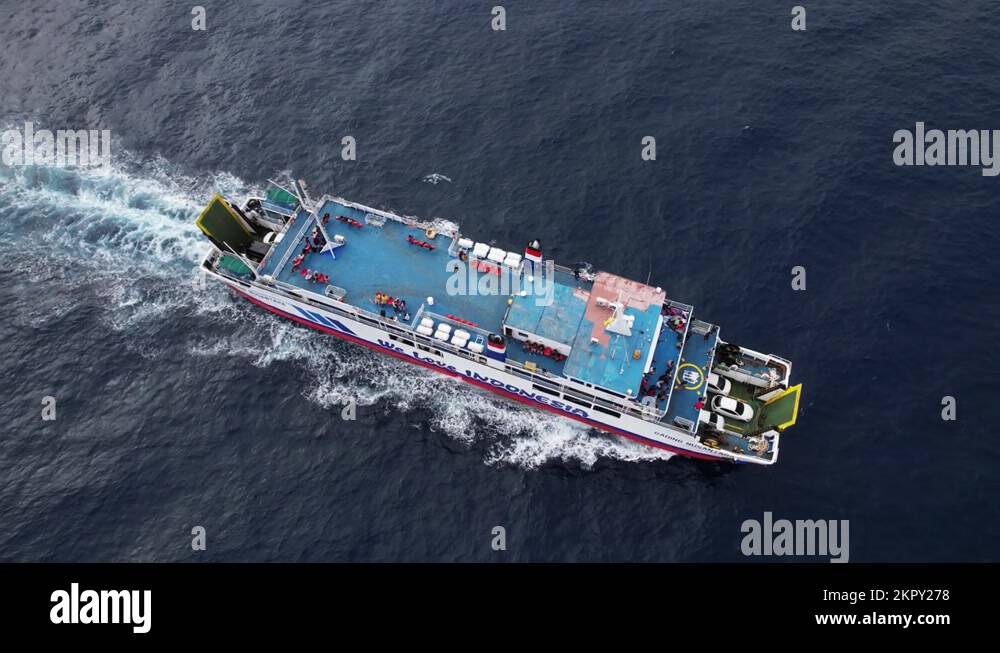 Rollon rolloff passenger vessel sail at sea, aerial trucking shot