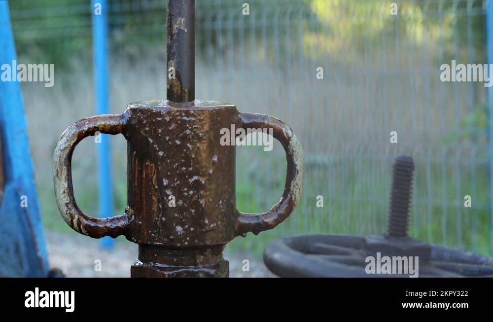 Eye level view of pumpjack polishing rod and stuffing box, crude oil
