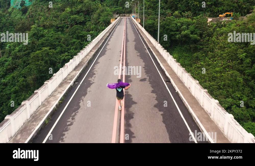 Tourist Man Running On AgasAgas Bridge In Southern Leyte, The