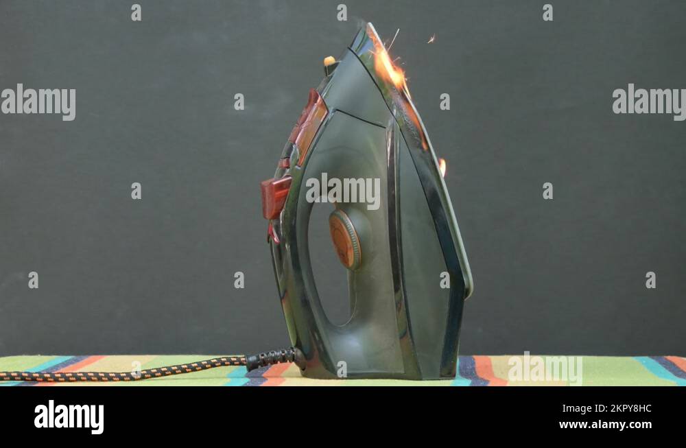 The cause of the fire is overheating of the iron. Ignition of an electric iron i Stock Video