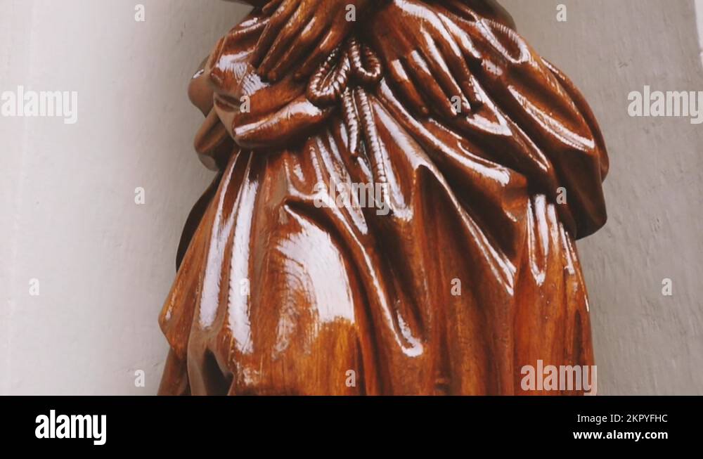 Slow tilt-up to Jesus Christ hands tied with a rope - statue made from ...