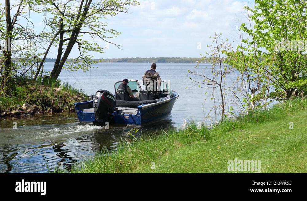 NISSWA, MN 27 JUL 2022 Motor boat slowly enters a Minnesota lake