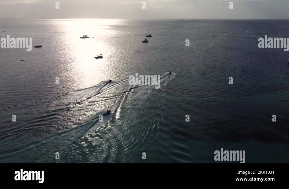 4 jet skis sailing out on the Indian ocean from Zanzibar in Tanzania in