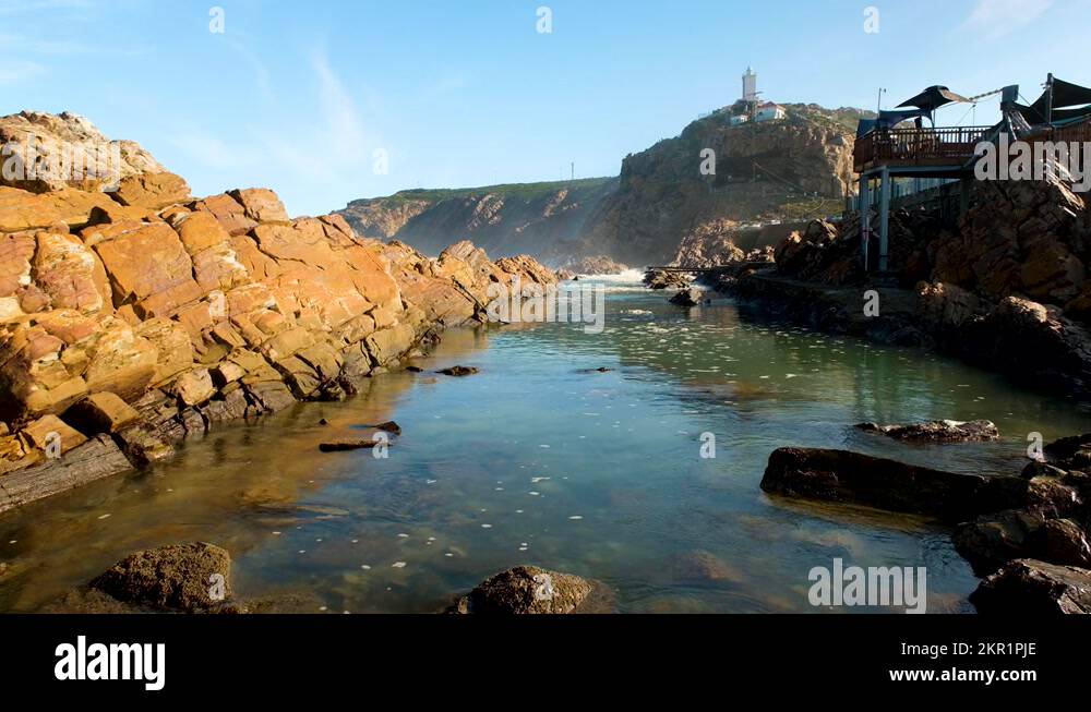 Popular natural tidal pool for swimming in Mossel Bay, Die Poort Stock Video Footage Alamy