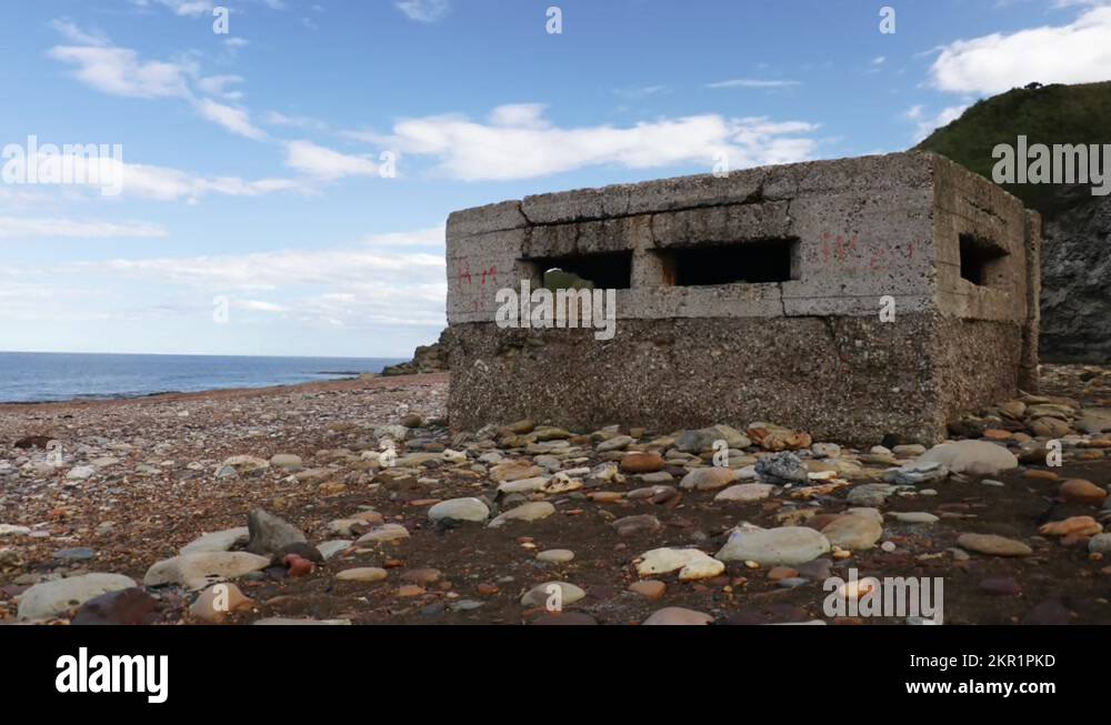 Pillbox or blockhouse from World War Two on a beach in England Stock