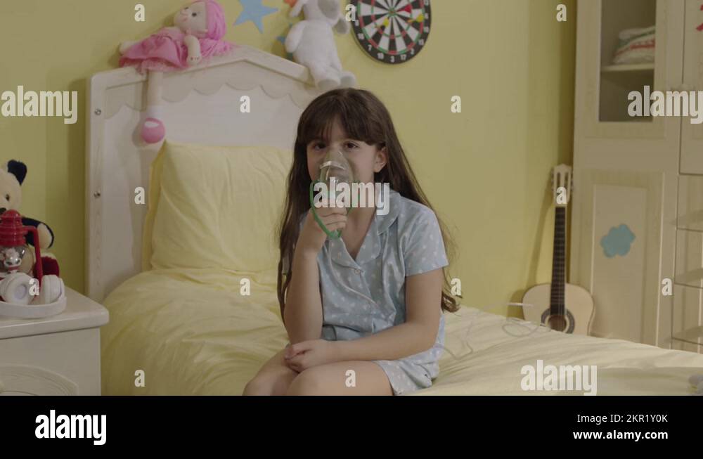 Little girl has shortness of breath in child bed, inhales smoke