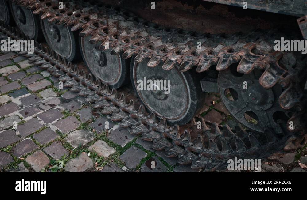 Caterpillar and wheels track of burnedout Russian tank. Close up