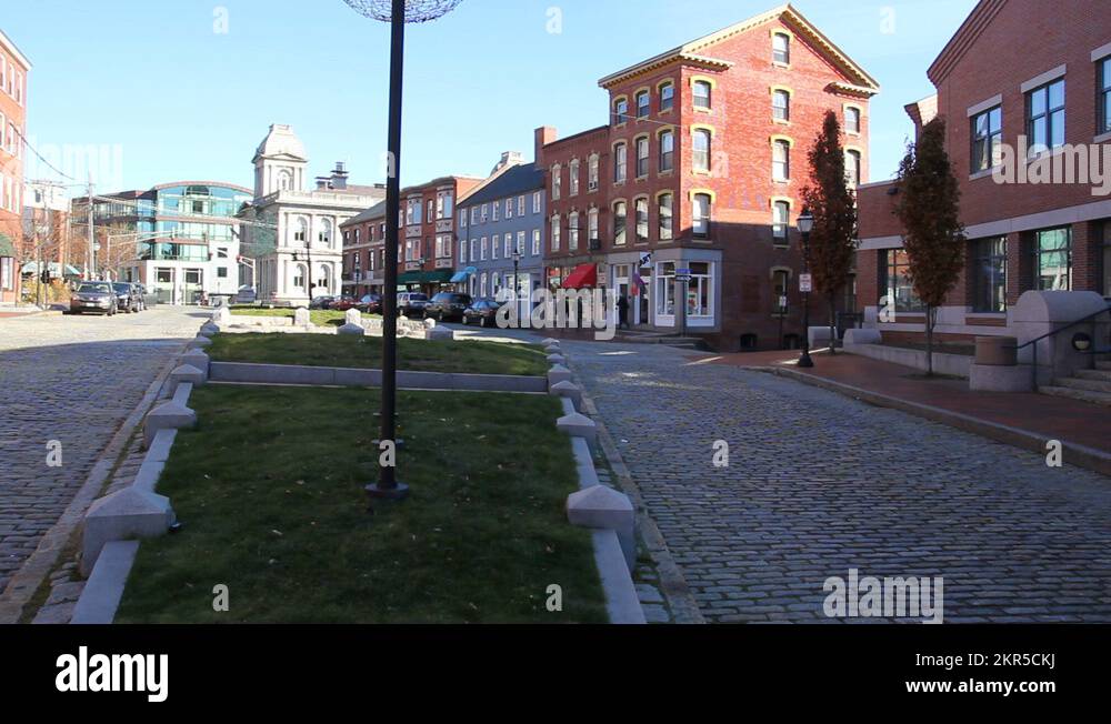 Cars pass through Portland Maine's historic Old Port District Stock