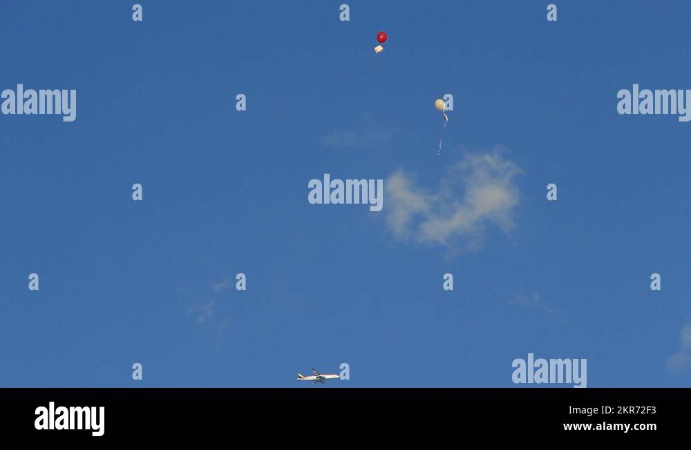 Two balloons & a plane Stock Video Footage Alamy