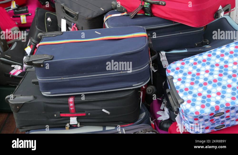 tilt of luggage on cruise ship waiting to be off loaded Stock Video