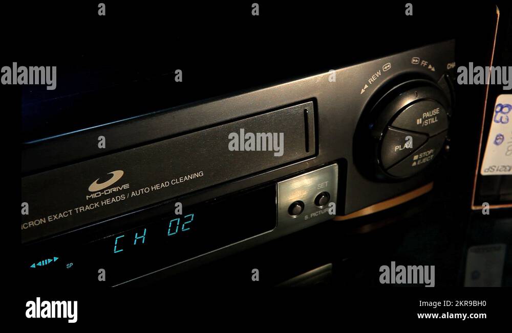 Inserting a VHS tape into the VCR 10 Stock Video Footage Alamy