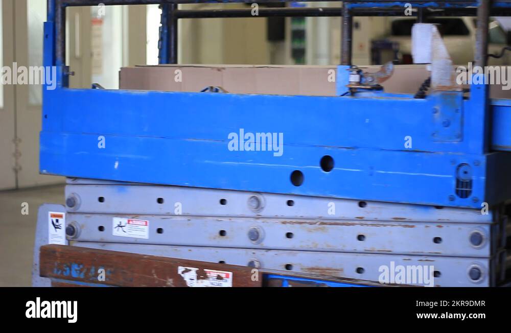 INDUSTRIAL SCISSOR LIFT GOES UP AND DOWN Stock Video Footage Alamy