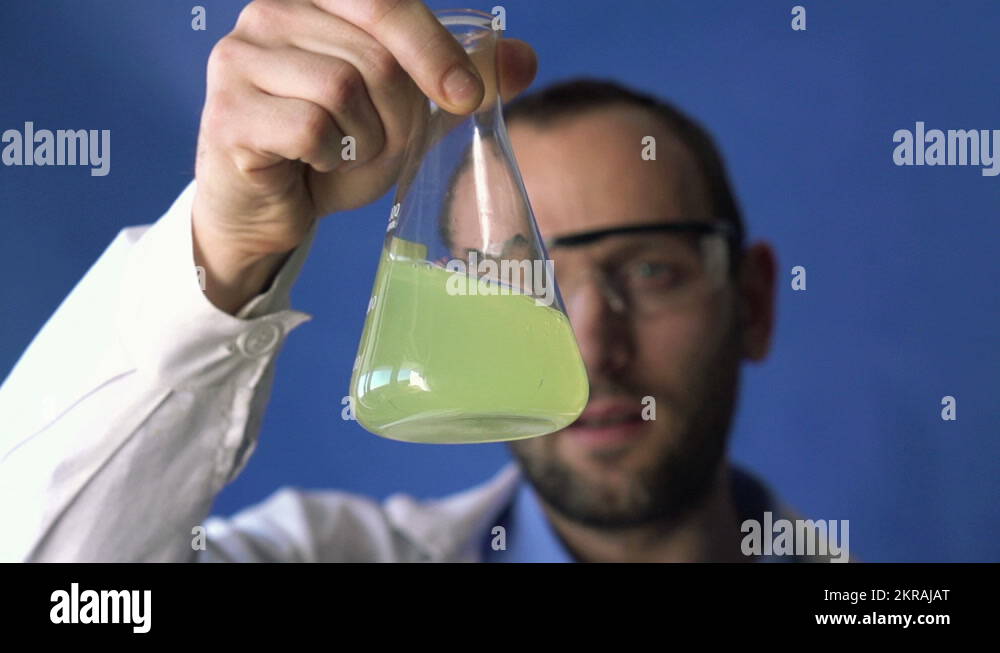 Chemist mixing chemicals in erlenmeyer flask HD Stock Video Footage Alamy