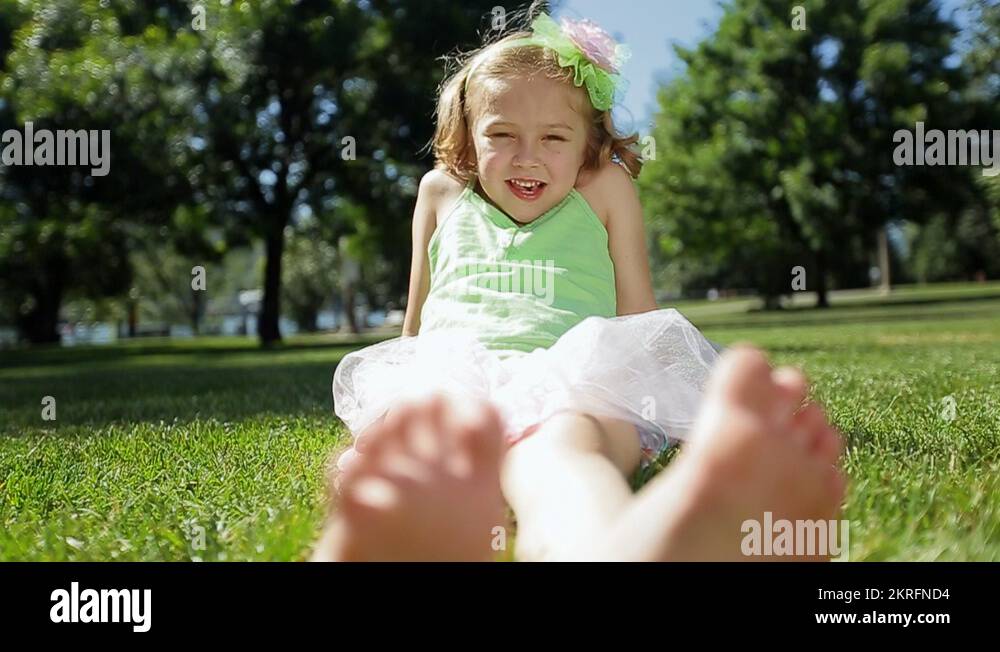 Kid feet smiley grass Stock Videos & Footage HD and 4K Video Clips