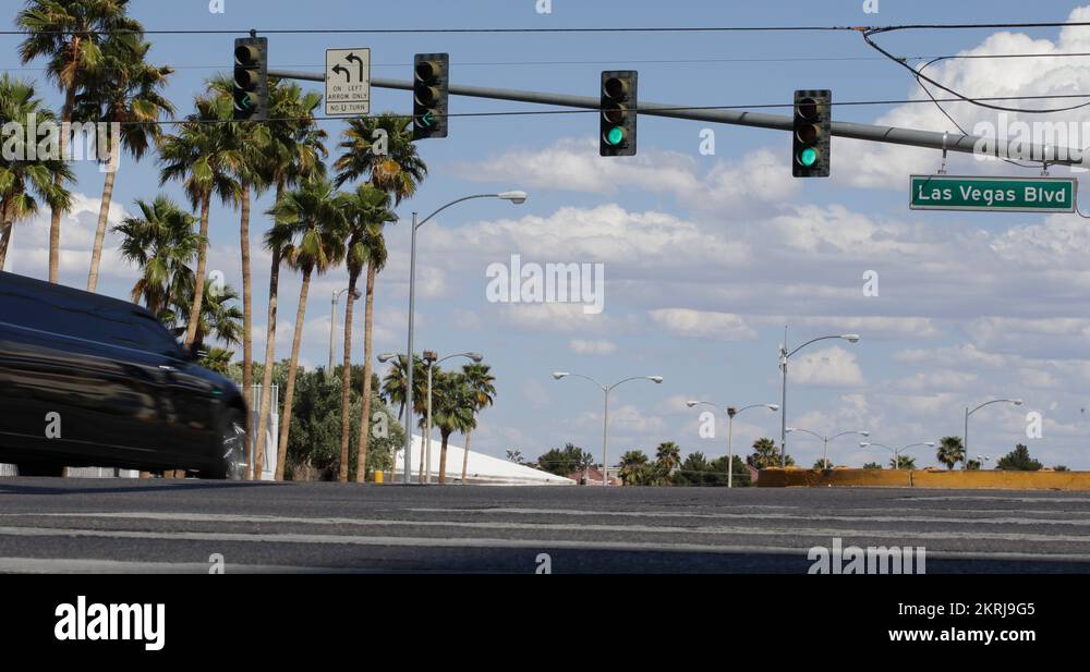 Black Limousine Passing Car Crossing Busy Intersection Las Vegas Strip