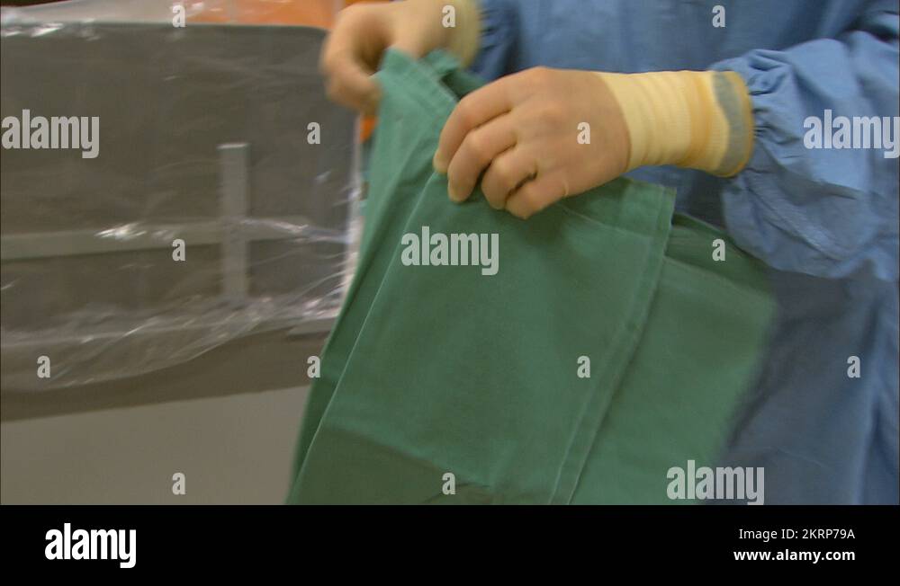 Doctor draping patient with sheet Stock Video Footage - Alamy