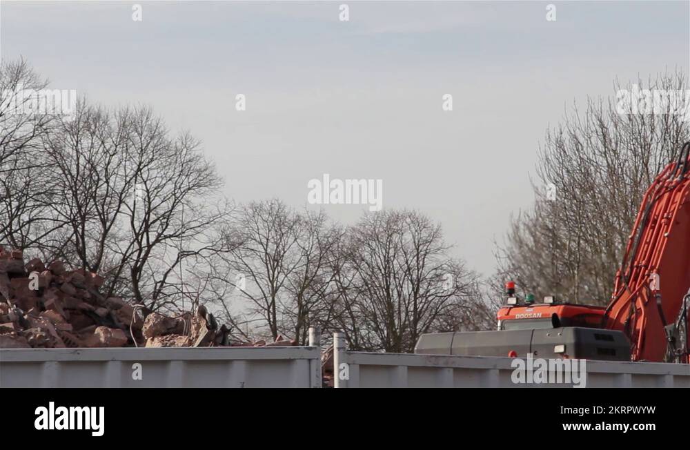 Large Hydraulic Digger Scoop & Arm lifting Rubble Construction