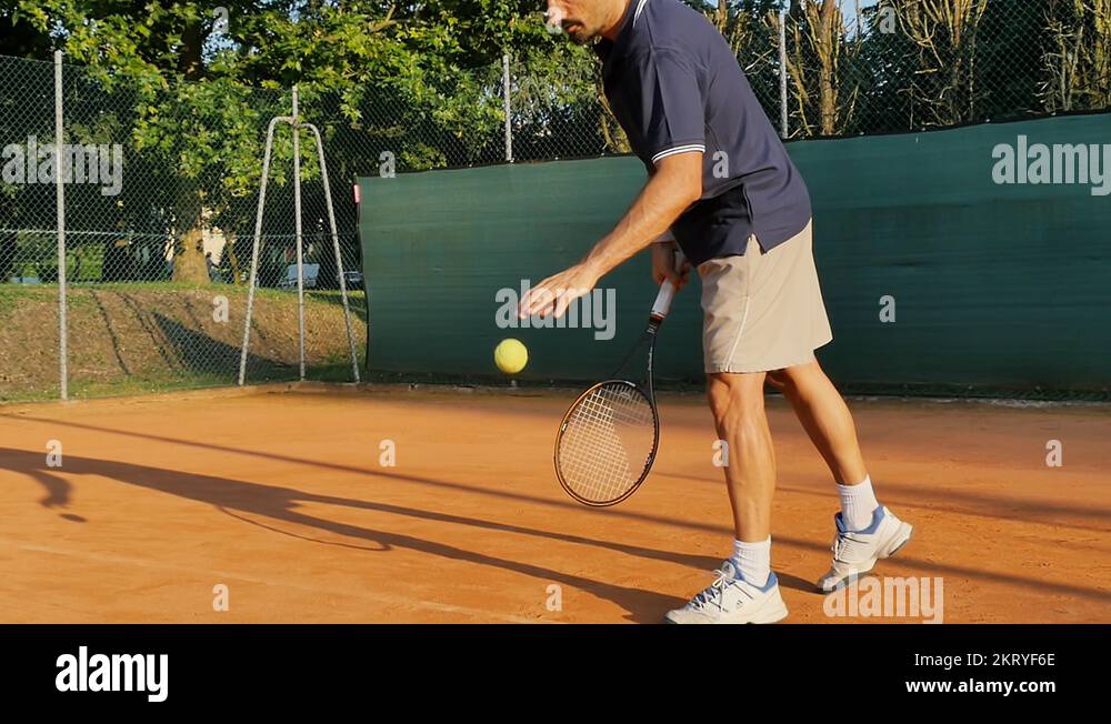 professional male tennis player serving ball slow motion crane shot