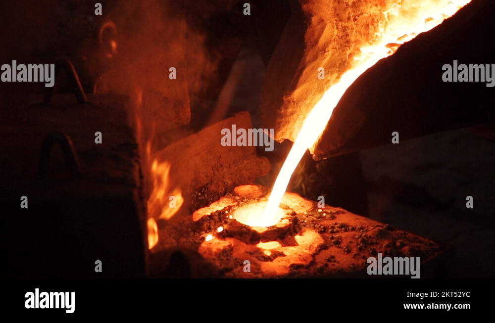 Metallurgy pouring liquid metal into a mold lab Stock Video Footage Alamy