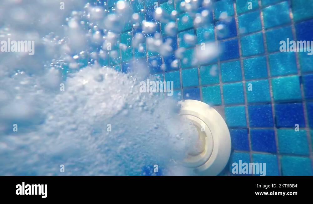 underwater bubbles from pool water jet filling hose, thermal spa pool
