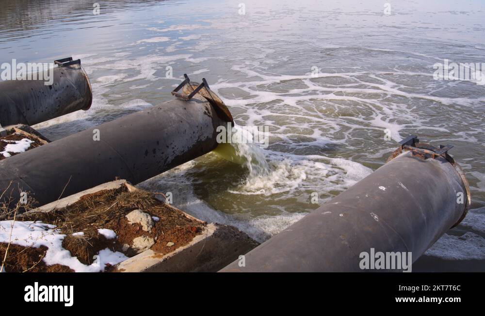 Discharge pipes, one dumping greenish water into Tule Lake Stock Video
