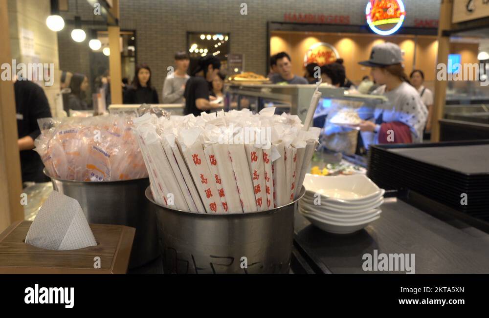 Chopsticks in a busy food court inside a shopping mall in South Korea