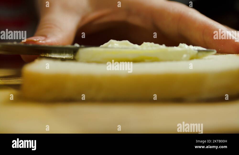 Woman Hands Buttering A Slice Of Bread Stock Video Footage Alamy