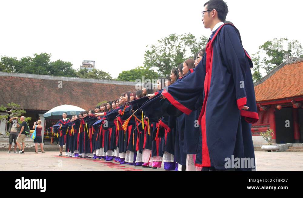 Graduates Teenagers Throwing Graduation Caps in the Air Stock Video