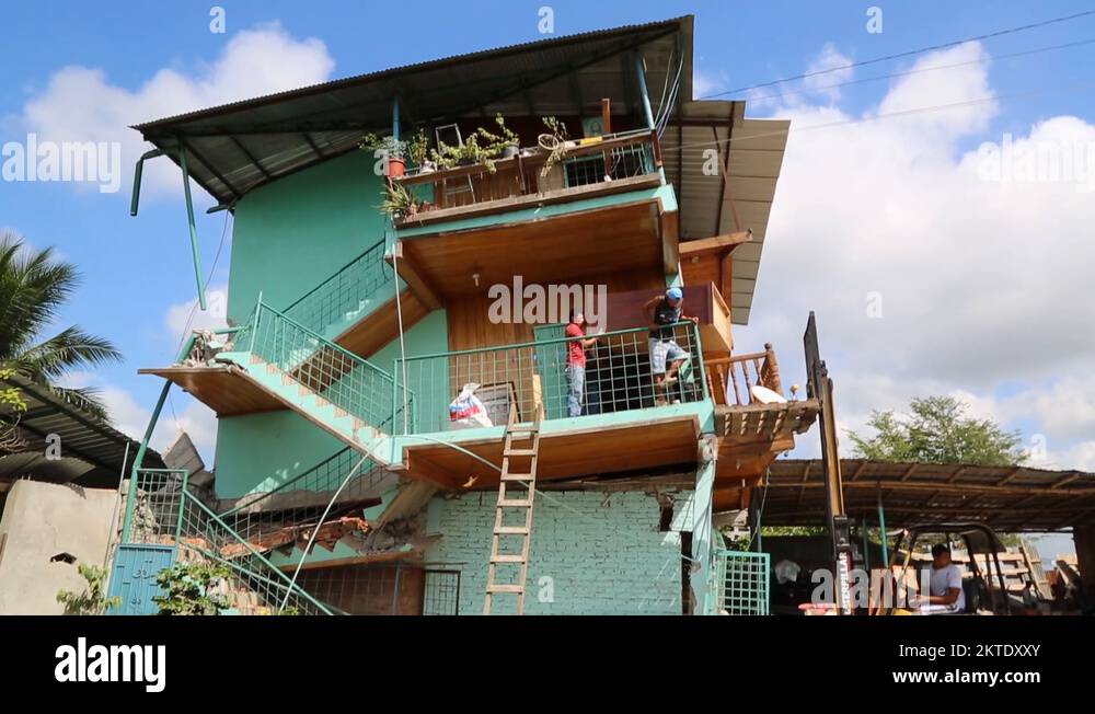 Tilt down of major building damage to house in Ecuador after the 2016