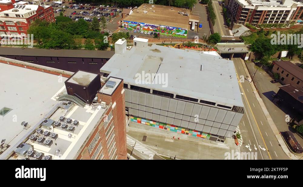 Ponce City Market Atlanta Aerial Track to Building Rooftop to Masquerade & Park Stock Video
