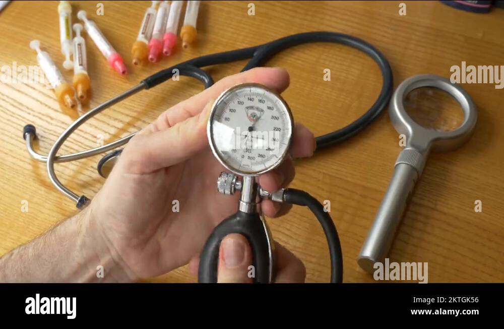 Doctor using medical tools blood pressure stethoscope model arteries