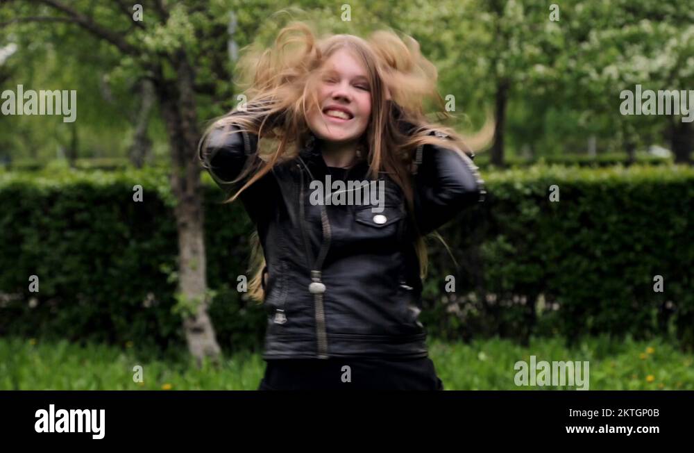 Beautiful teenage girl long blond hair moving dancing crazy emotions in