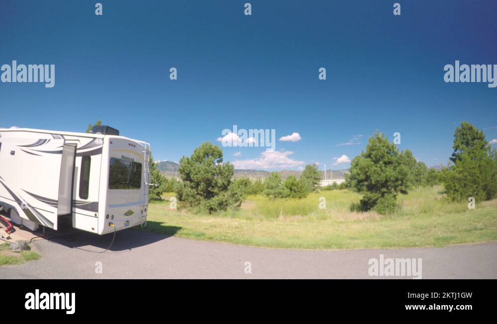 Car driving through campground with motorhomes at Chatfield State Park