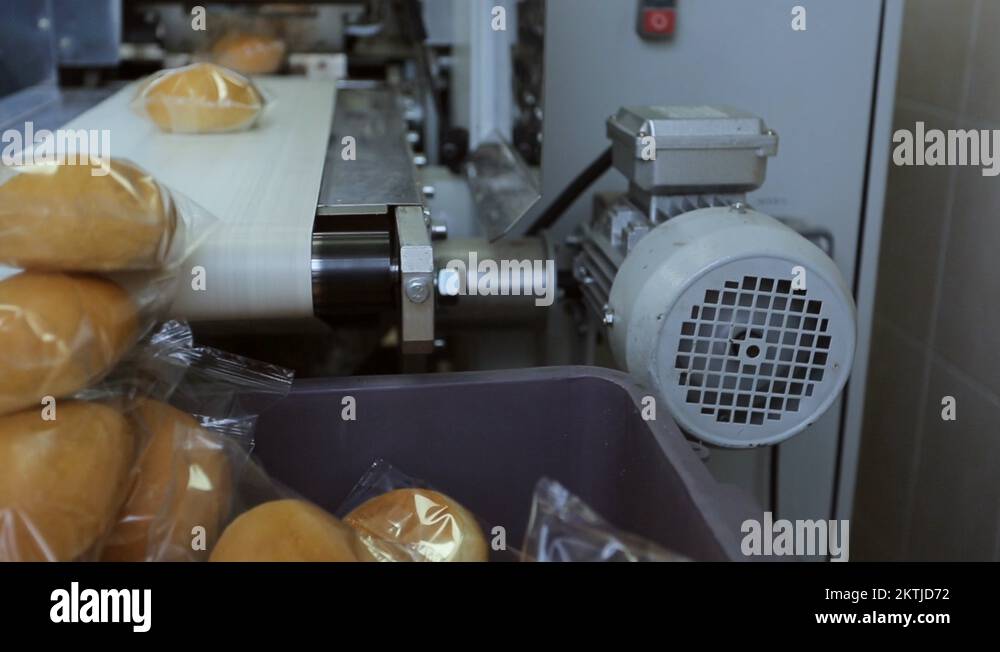 Bread for passengers of plane, packed on conveyor in transparent film