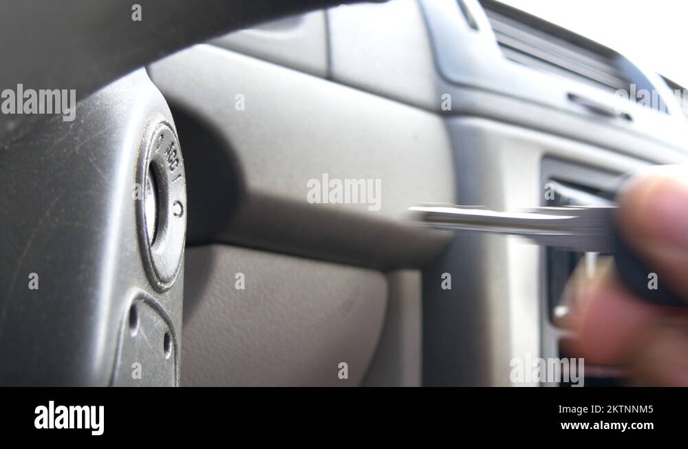 An ignition key is put into the ignition and starts the car Stock Video