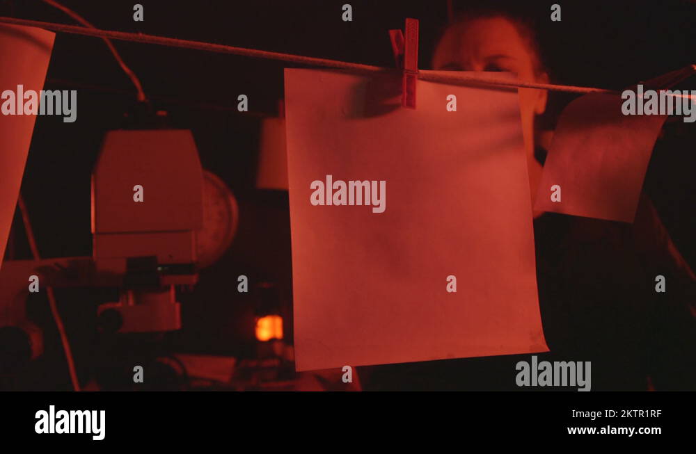 Home darkroom setup photographer making black and white prints Stock