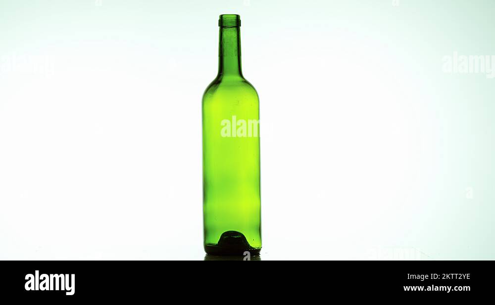 Bottle of Wine Breaking and Exploding against White Background, Slow