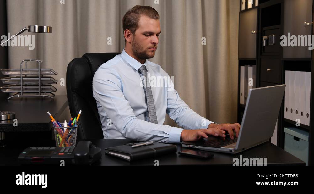 Busy Ceo Businessman Talking Landline Phone and Browsing Laptop