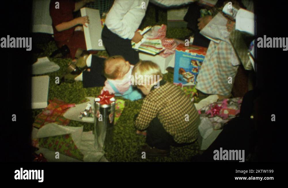1974 christmas tree is seen with child opening presents FORT WAYNE