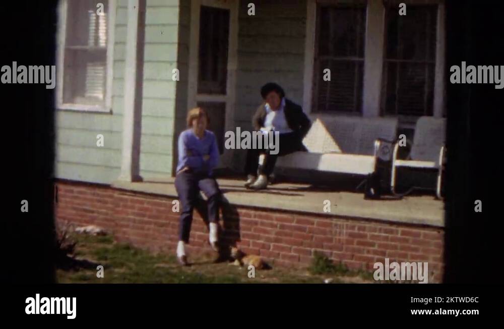 1967: two women sitting out on the front porch of a house ARIZONA Stock ...