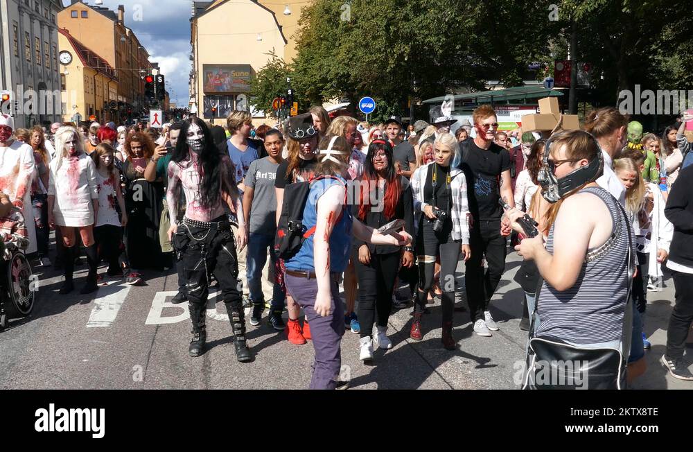 Crowd of zombies yelling and making horrifying sounds, zombie walk in