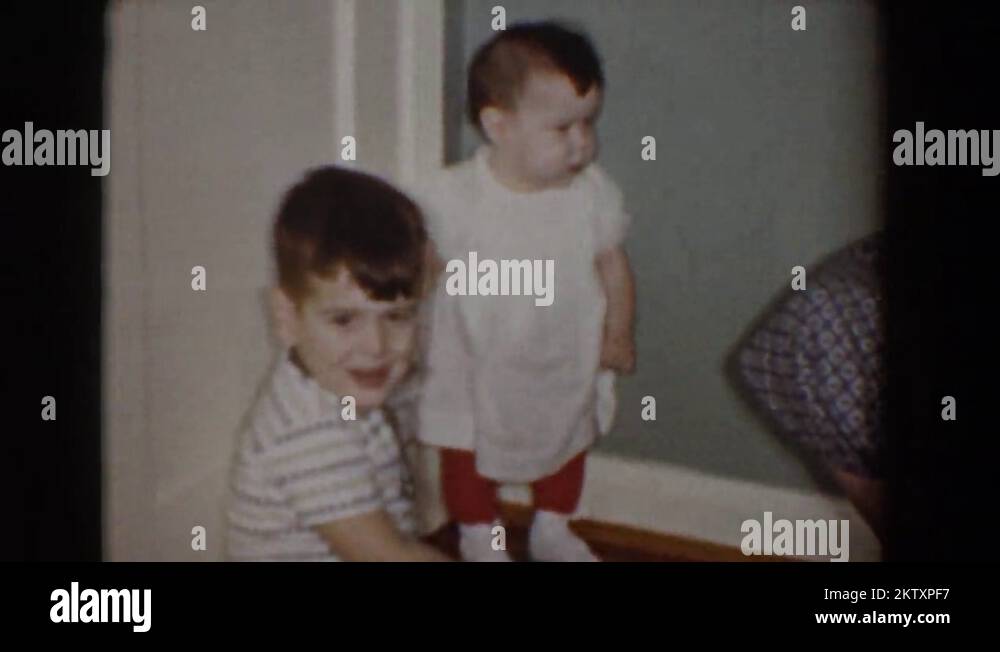 1960: a little boy, his baby sister, and his mom in the living room BEL ...