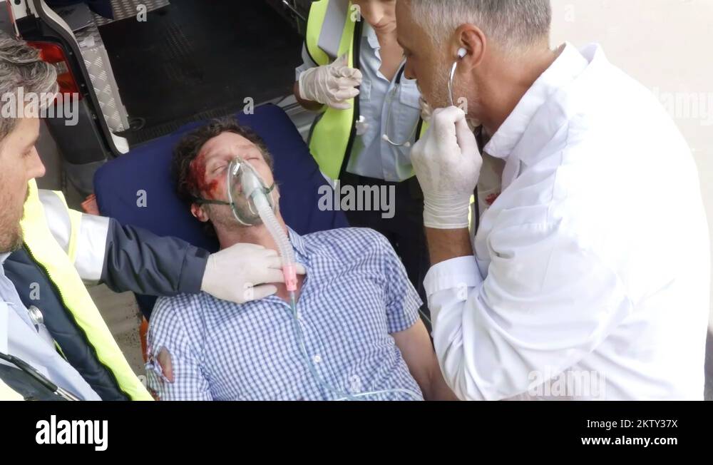 Paramedic using an external defibrillator during cardiopulmonary