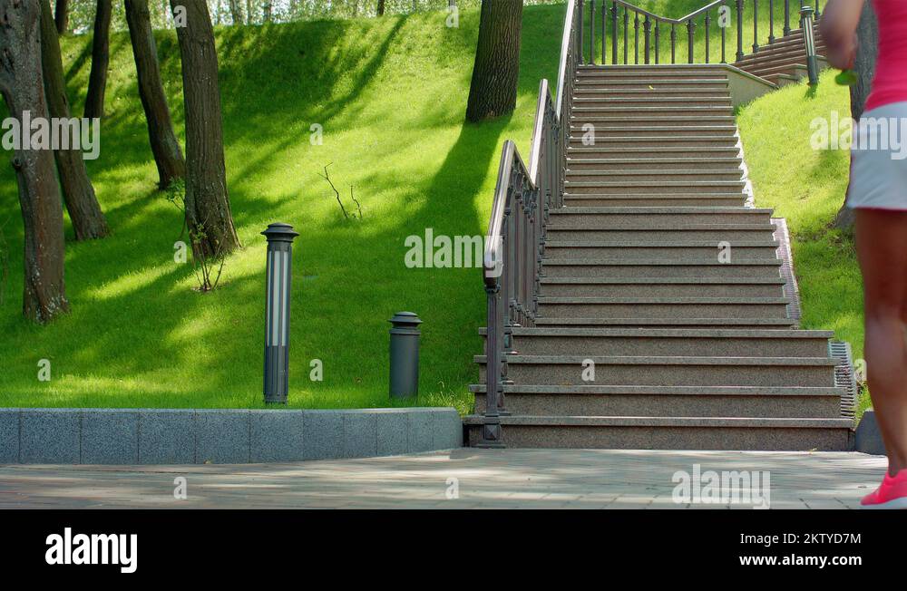 African woman run up stairs. Fat woman running up stairs. Weight loss